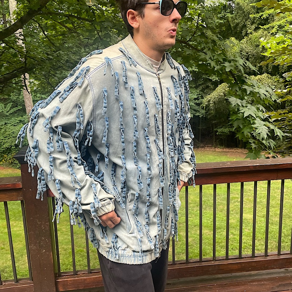 L.A. based designer 69 Brand vintage denim fringe jacket.